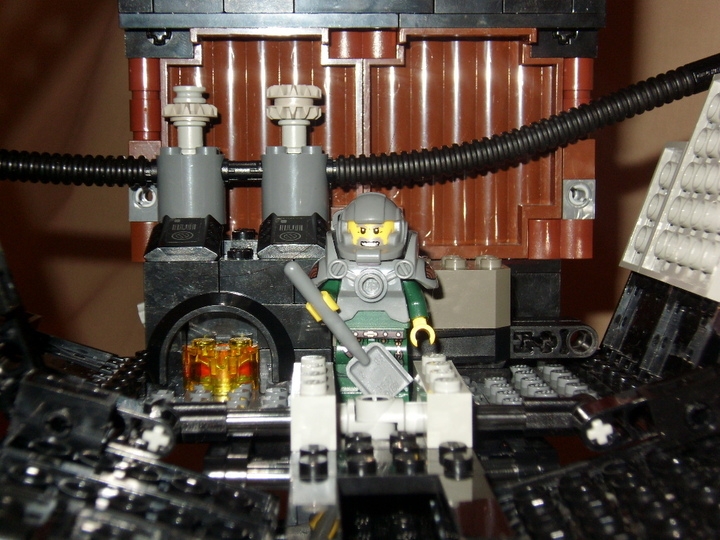 LEGO MOC - Мини-конкурс 'Битва Дирижаблей' - Небесная Акула: Чтобы поддерживать двигающую систему,когда дирижабль не лежит в дрейфе на потоках ветра,внутри оборудована система из паровых котлов.Так как внутренняя часть наполнена гелием,а не водородом,то можно обеспечить прямой доступ к огню в топке.Заведует всем кочегар в термозащитном костюме с приводом кислорода.