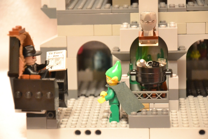 LEGO MOC - Новогодний Кубик 2014 - 'В глубине виллы 'Ночной кошмар'...: В кабинете мага стояла семейная реликвия - кресло с высокой спинкой. Четыреста лет тому назад один умелец-вампир - золотые руки, сколотил это кресло из  досок собственного гроба. На обивку была пущена шкура вервольфа – надо заметить, впрочем, что за четыре столетия обивка малость повытерлась. Это кресло Шуткозлобер получил в наследство от предков и обращался с ним необычайно бережно, хотя вообще он был колдуном вполне современным и не отставал от прогресса.
