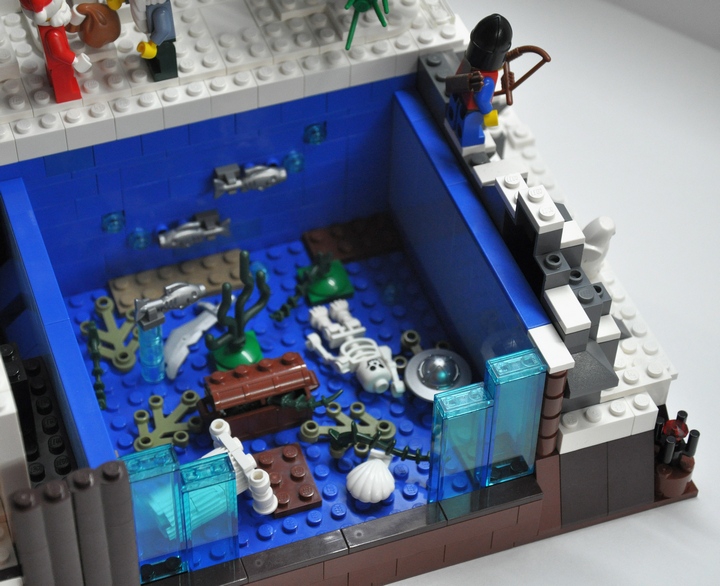 LEGO MOC - Новогодний Кубик 2014 - Фестиваль ёлок: Интересно, а что под льдом, который сковывает речку?<br />
А рыбы тут не видимо, и от каждой идут пузырьки.. Ух-ты, да тут кроме рыбы и сундук на дне стоит... и наверно битком набитый сокровищами.. а сундук охраняет воин-скелет.... ну это уже совсем другая история. 