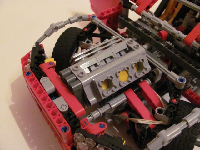 LEGO MOC - Technic-конкурс 'Легковой автомобиль' - Nissan Skyline GT-R R34.: В двигательном отсеке не стал заморачиваться - т.к. не умею) Лишь двигатель и распорка передних колес.