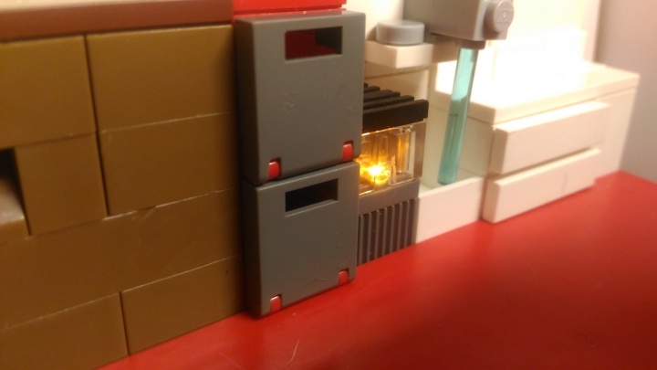 LEGO MOC - Новогодний Кубик 2017 - Новогодняя комната семьи: Плита загорается ораньжевым цветом.