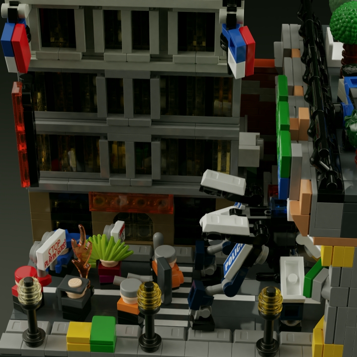 LEGO MOC - 16x16: Микро - Революция человечества. Рассвет и закат Детройта: </center></i><br><br />
Даже в колонне движимых общей целью людей виден разный подход к способам её достижения - в то время, как некоторые из протестующих держат в руках плакаты с лозунгами против вмешательства в естественный процесс революции (один из них, 'stop playin' gods'/'перестаньте изображать из себя богов', весьма красноречиво намекает на это), более отчаянный и отчаявшийся человек в сером капюшоне держит наготове 'коктейль Молотова'. Правда, и меры предосторожности, принятые полицией в отношении небольшой группы, можно счесть лишними.<br />
<i><center>