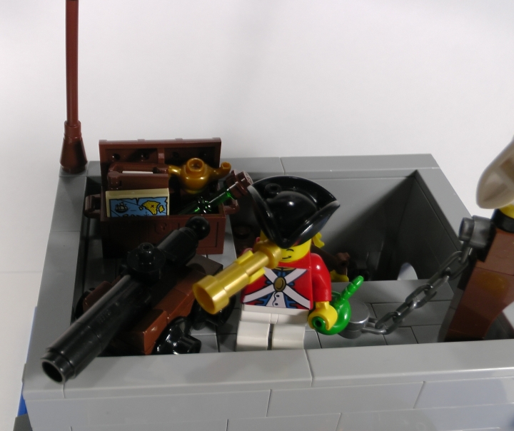LEGO MOC - LEGO-конкурс 24x24: 'Пираты' - Бомба для губернатора или Драма на КПП: Обратите внимание на ящик с конфискованным за смену имуществом, стоящий за пушкой. Здешний гарнизон состоит-таки из романтиков...